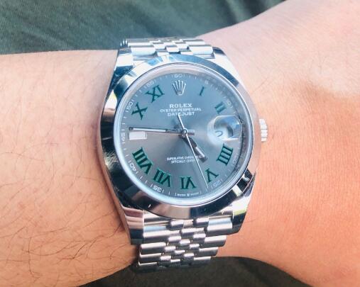 The green Roman numarals hour markers are striking on the grey dial.
